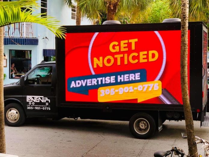 Mobile Billboard Crackdown - A truck is parked on the side of a building - Florida Keys