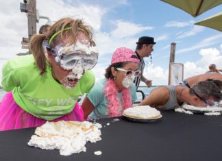 Key Lime Festival 2019 - A group of people sitting at a table eating food - Key West