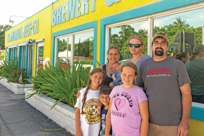 Middle Keys baby makes sudden appearance in unlikely spot - A group of people posing for the camera - Islamorada Beer Company