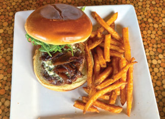 New gastro pub pushes the envelope with whimsical fare New gastro pub pushes the envelope with whimsical fare - A sandwich is sitting on the side of fries - French fries