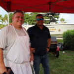 COMMUNITY PARTNERS – Family, food and fun with first responders - A man holding an umbrella - Car
