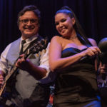 90 miles closer – Havana Nights Heats up the Stage at Key West Theater - A man and a woman sitting on a stage - Florida Keys