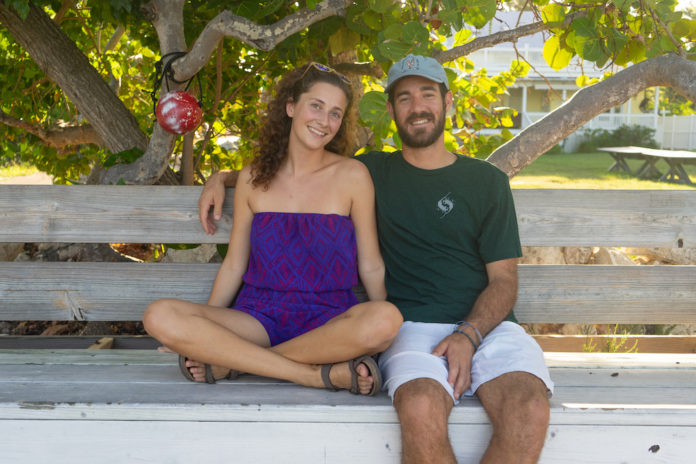 Keys couple uses art to inspire others, protect nature - A man and a woman sitting on a bench posing for the camera - Florida Keys