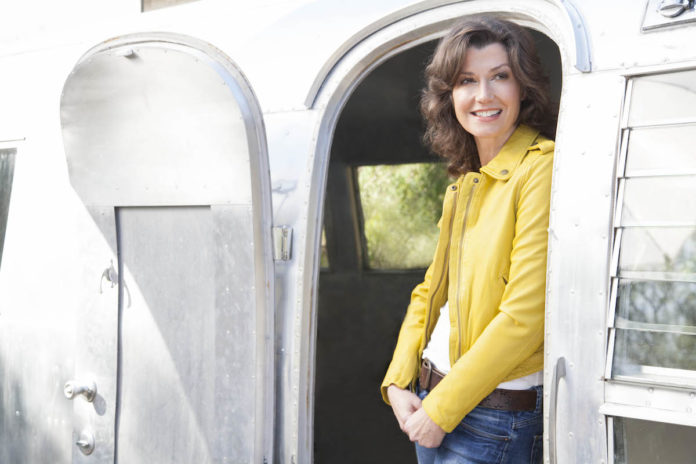 Amy Grant on Finding the Extraordinary Every Day - Amy Grant standing in front of a car - Amy Grant