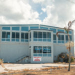 Keys Weekly photographer documents Bahamas plight - A bus parked in front of a building - Florida Keys