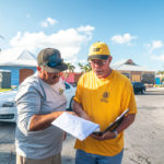 Keys Weekly photographer documents Bahamas plight - A man holding a sign - Florida Keys