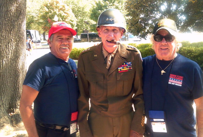Capt. Skip tours nation’s capital with fellow vets - A couple of people that are standing together in uniform - Car
