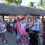 PINK ARMY – Inaugural bra walk in Key Largo sees large support - A group of people standing in front of a crowd posing for the camera - Public space