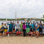 CELEBRATING CONSERVATION DECK: REEF Fest brings education, adventure - A group of people on a beach posing for the camera - Sea kayak