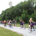BROOMSTICK PARKING ONLY – Annual Witches’ Ride raises funds for cancer research - A group of people riding on the back of a bicycle - Road bicycle racing