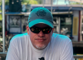 Caffeine Carl: Key West’s own music man - A man wearing a hat - Sunglasses