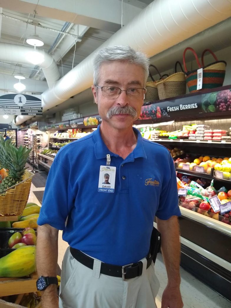 ‘I’m a Working Man’ – Businesses, adults with disabilities benefit from jobs - A man standing in front of a store - Grocery store