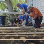 Guess what? Habitat is still helping homeowners recover from Irma - A group of people sitting on a bench - /m/083vt