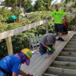 Guess what? Habitat is still helping homeowners recover from Irma - A group of people sitting on a wooden bench - Leisure