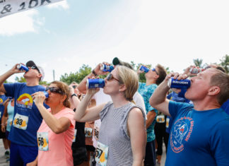 RUN, DRINK, RUN – Spots almost filled or annual Islamorada race - A group of people standing in front of a crowd - Half marathon