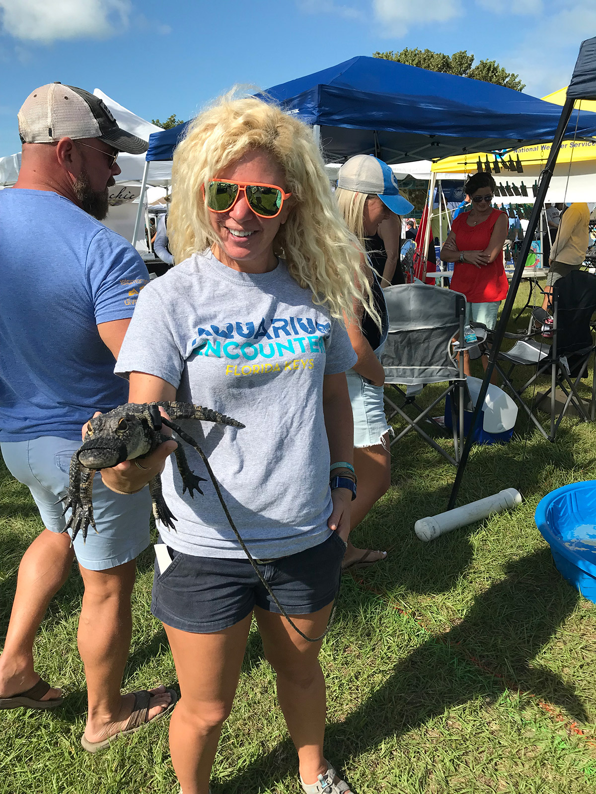Kee Blight, marine biologist at Aquarium Encounters, holds a baby alligator during last year’s inaugural Mote Ocean Fest: A Community Celebration at Founders Park in Islamorada. FILE PHOTO
