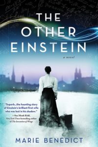 Women making a difference – The under-told stories of the 3 courageous women - A man holding a sign - The Other Einstein: A Novel