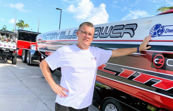 Powering through Key West – Rodrick Cox: A familiar face in new, improved boat races - A man standing in front of a car posing for the camera - Car