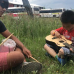 Kevin Martinez, left, and his little “host brother” in Mongolia overcame language barriers with music. Contributed photo