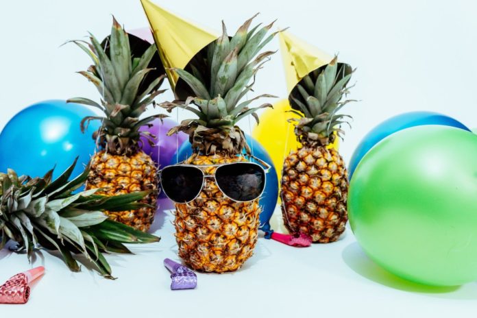 A pineapple sitting on a table - Party