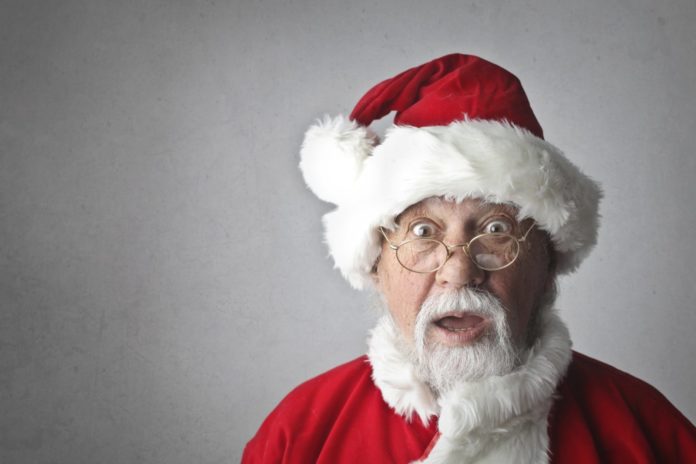 Top 10 worst philanthropic causes this holiday season - A man wearing a red hat - Santa Claus