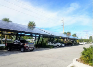 Solar panels save Key West $1,100/month - A car parked on the side of a road - Luxury vehicle