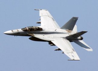 NAS Key West High Intensity Jet Training Scheduled - A fighter jet flying through a blue sky - Boeing F/A-18E/F Super Hornet