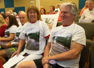 RISING TO THE OCCASION RISING TO THE OCCASION - A group of people in a room - Community