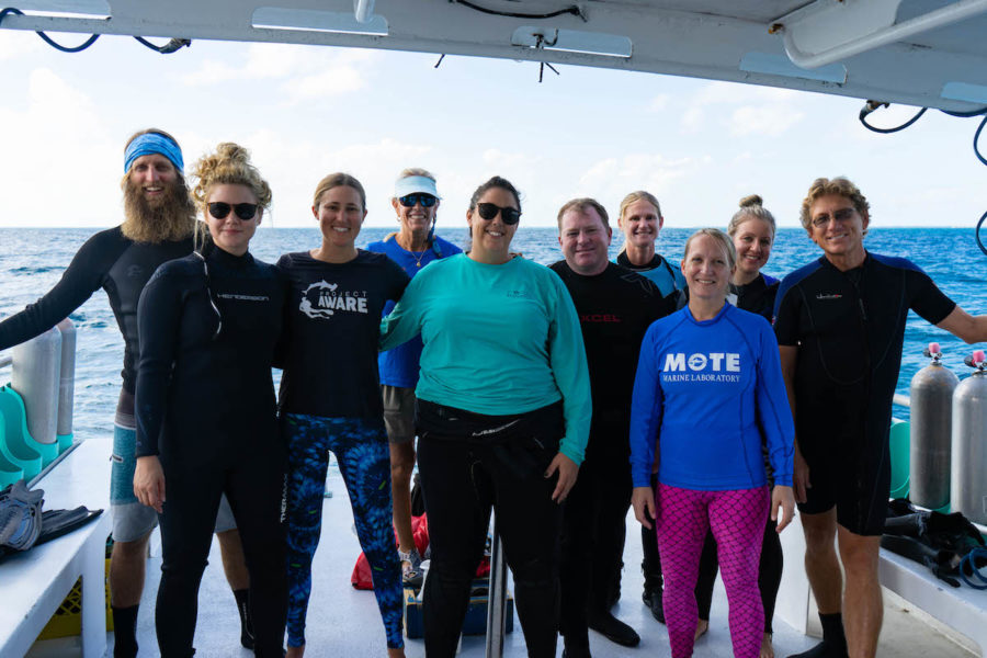 NOAA Launches $97 Million Targeted Mission to Save Florida Reef Tract - A group of people posing for a photo - Dry suit