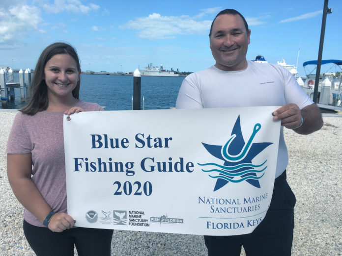 Add three more Blue Star Fishing Guides - A person holding a sign posing for the camera - T-shirt