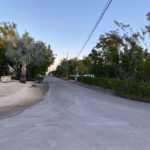 Flood-free finally for Key Largo community - A sign on the side of a road - Road surface
