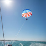 GLIDING INTO SEASON LIKE … - A boat in the water - Parasailing