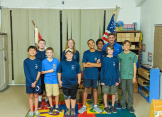 Thankful Troop Gives Back - Marie Critchley et al. posing for a picture - Indoor games and sports