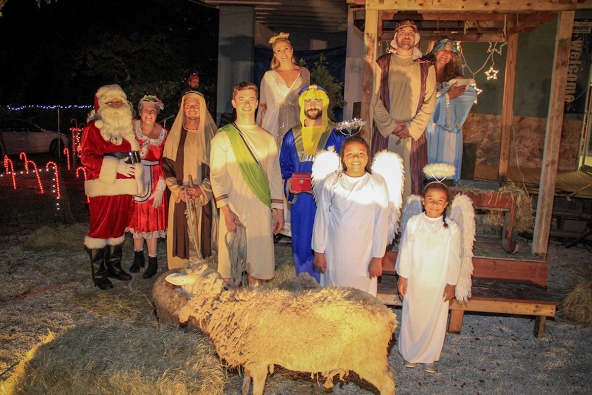 The keys get lit - A group of people posing for the camera - Nativity scene