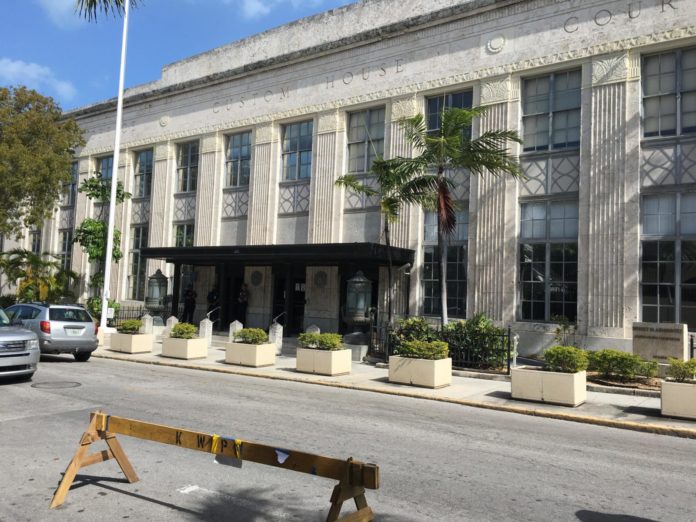Courthouse parking, sidewalk dining, city approves both - A bus driving down a busy street - Duval Street