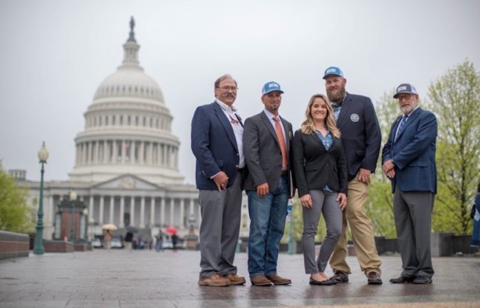 ‘Fix the water, protect the habitat and pass on a pristine Florida Keys to future generations’ - A group of people standing in front of a building - United States Capitol