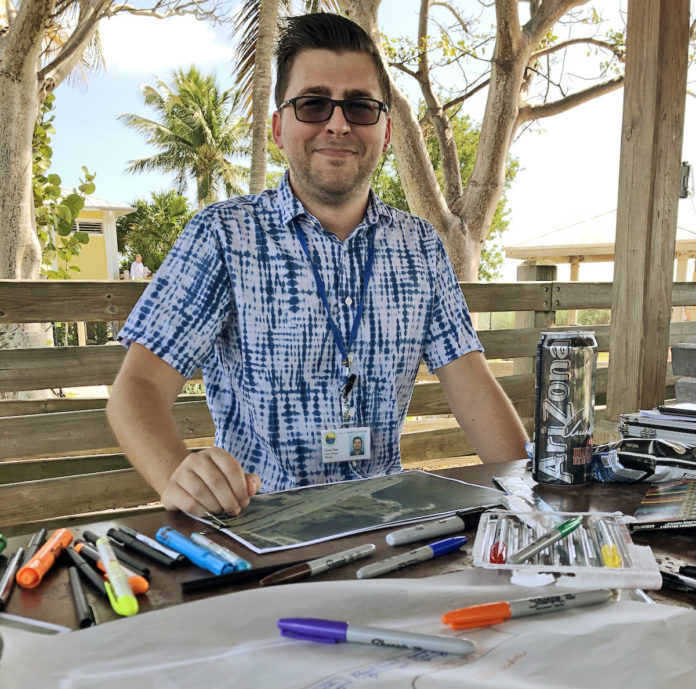 Brian Shea of the City of Marathon mans the table at Sombrero Beach to collect ideas for redeveloping the former Quay property, now a city park. More sessions are scheduled. SARA MATTHIS/Keys Weekly