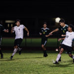 Sophomore Christian Rodriguez (8) goes up and wins a contested header against a Keys Gate player.