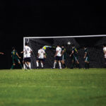 A boot by Caleb Danko (10) of Coral Shores goes past the Keys Gate goalie towards the back of the net.