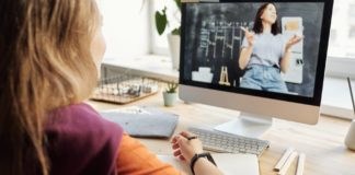 photo of girl watching through imac