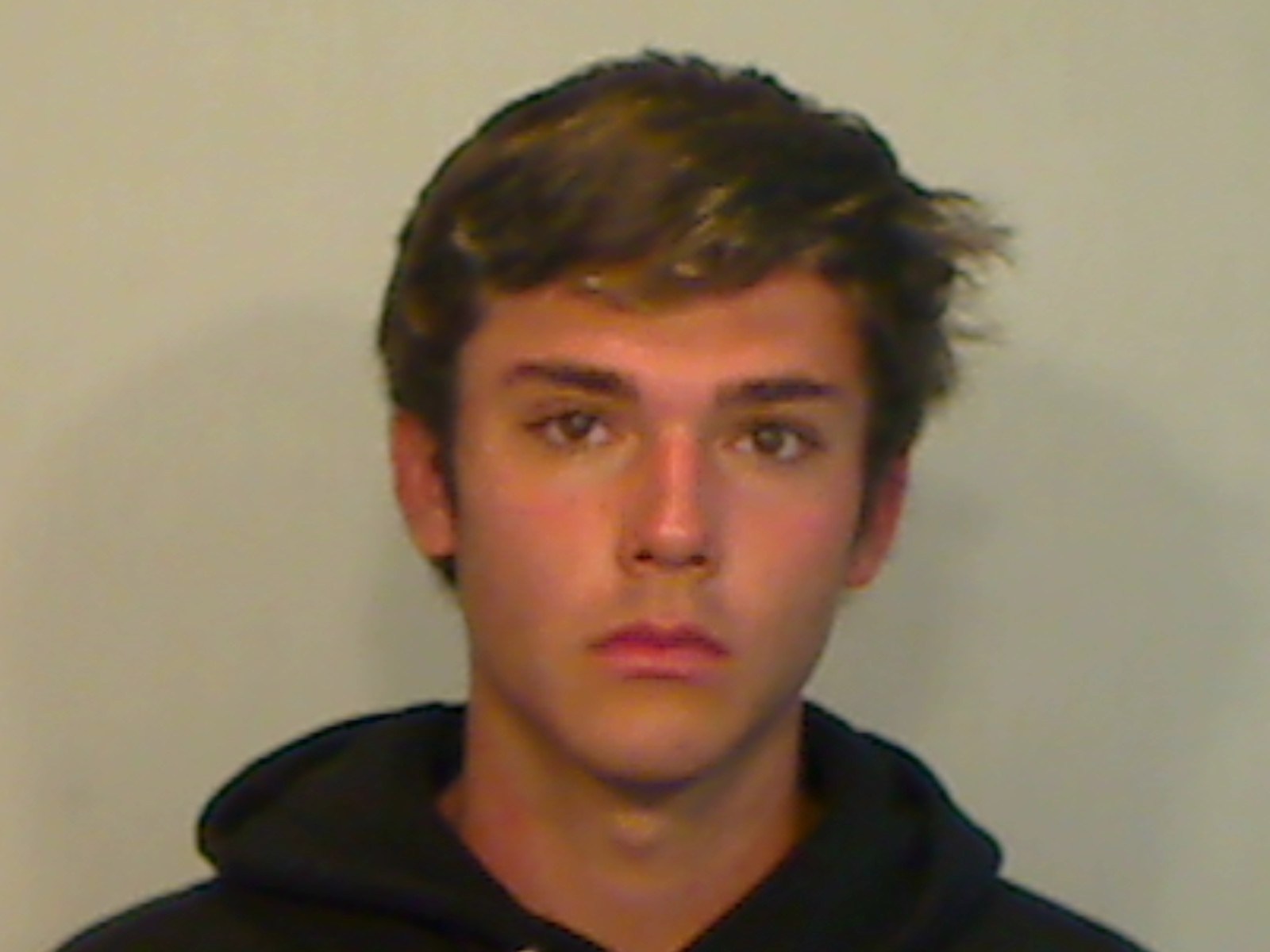 College student charged after reportedly removing, taking photo with