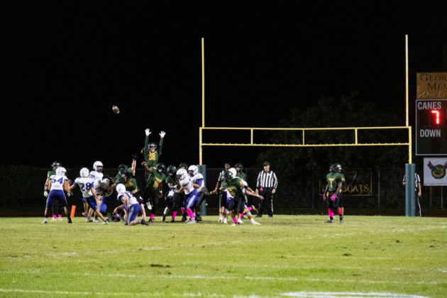 a group of people playing a game of football