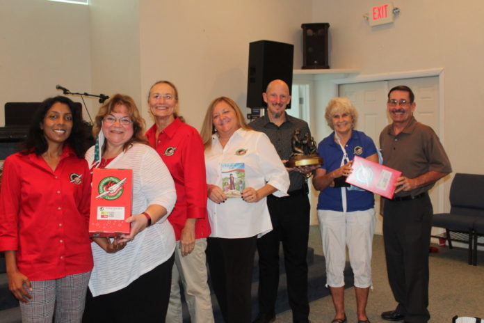 Operation Christmas Child 15 years a group of people standing in a room