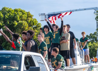 IN PICTURES: CORAL SHORES HOMECOMING HOMECOMING PARADE a group of young men standing on top of a truck