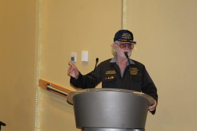 a man standing at a podium giving a speech