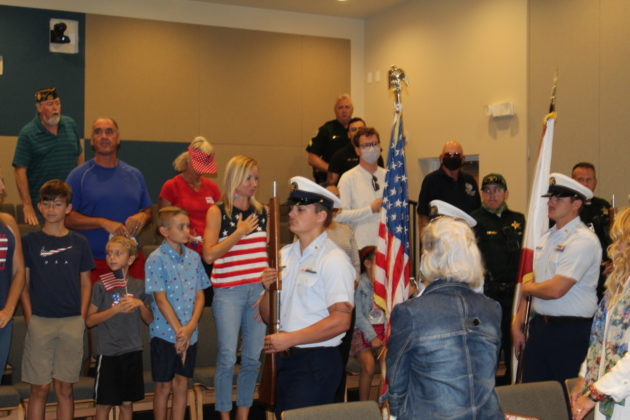 a group of people that are standing in a room