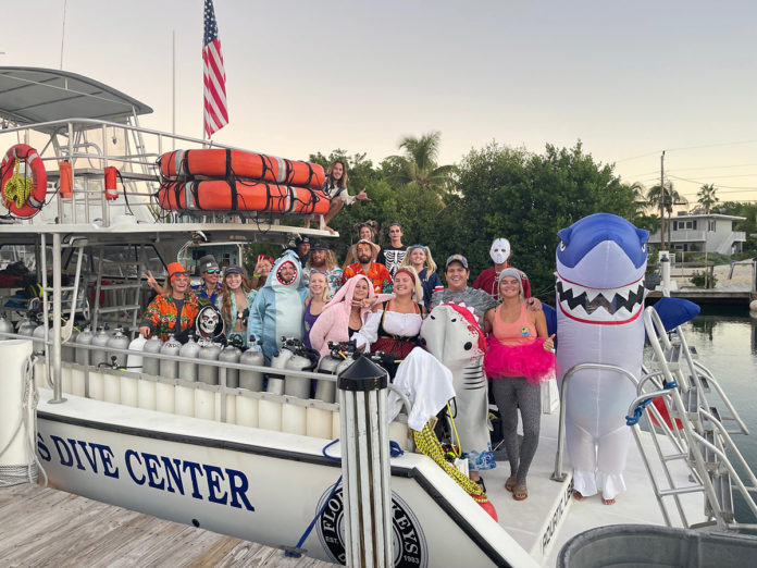 a group of people standing on a boat