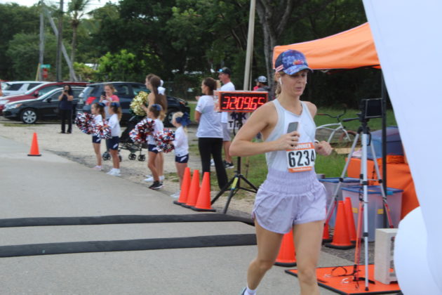 a woman running in a marathon in a race