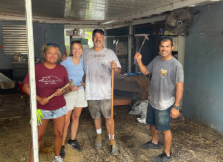 a group of people standing in a shed