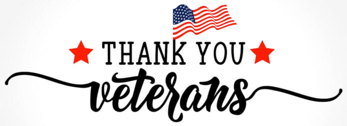 a thank you veterans sign with an american flag